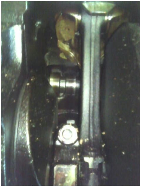 1980 Ford Bronco - Close-up view of an engine's crankshaft and connecting rod, with a watermark from Supermotors.net visible.