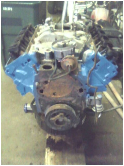 1980 Ford Bronco - Engine block with blue valve covers and distributor cap is shown.