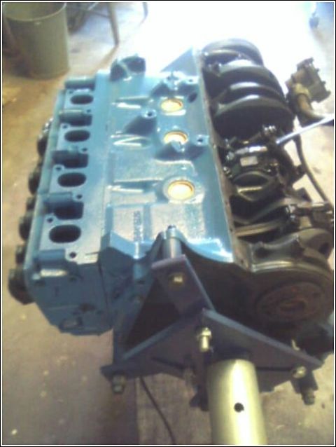 1980 Ford Bronco - A blue engine block and crankshaft are shown, likely a replacement part for a vehicle.