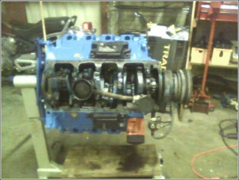 1980 Ford Bronco - Engine block assembly on a stand, likely undergoing rebuild or inspection.