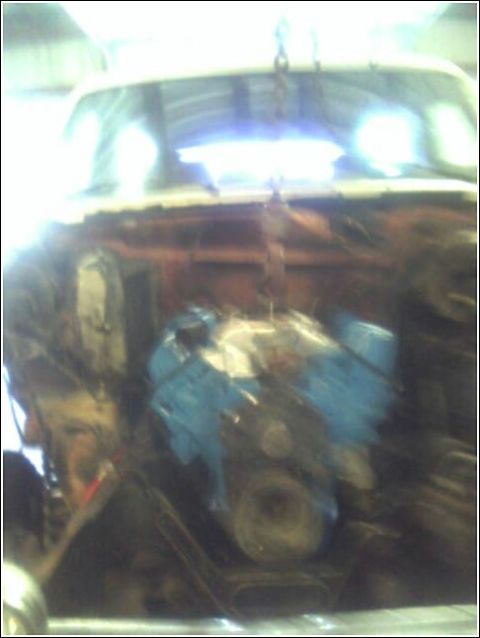 1980 Ford Bronco - Engine installation in progress, focus on the engine itself.