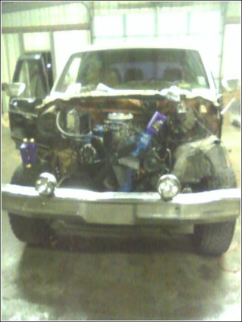1980 Ford Bronco - Front view of a 1980 Ford Bronco with the engine removed for maintenance or repair.