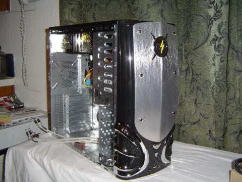 1989 Ford Bronco - A computer case with a distinctive front panel design sits on a table.