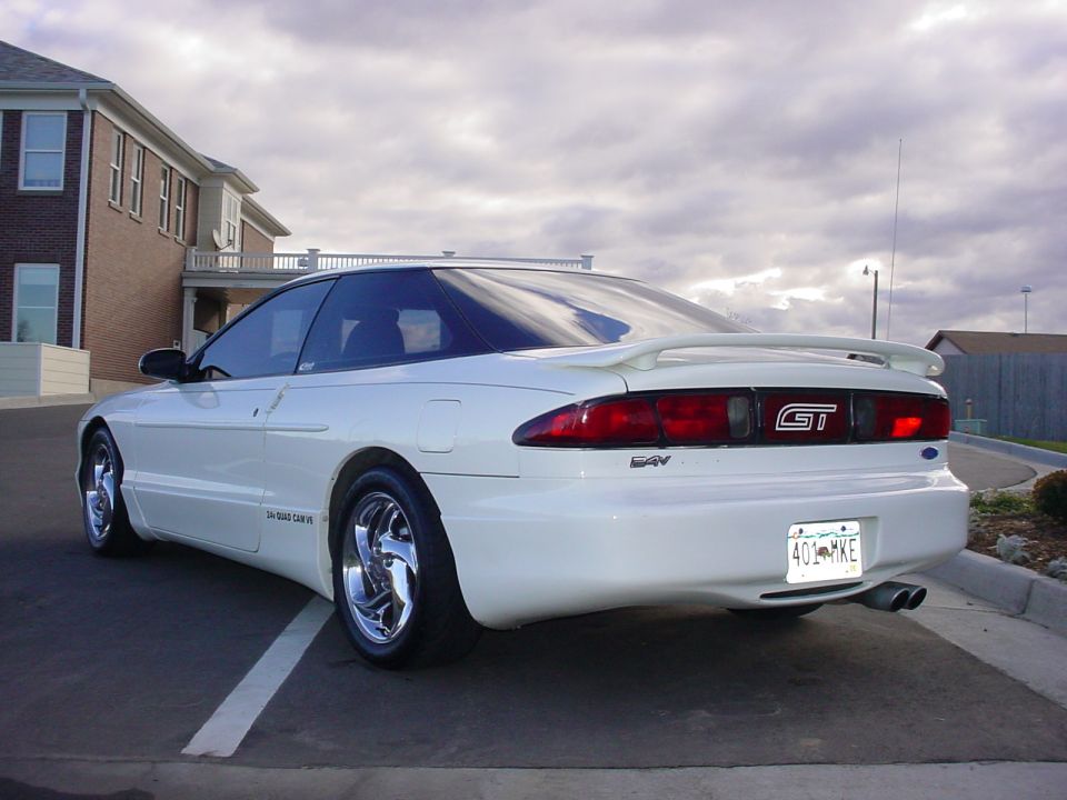 White 1996 Ford Probe GT parked, rear view showing spoiler and GT badge