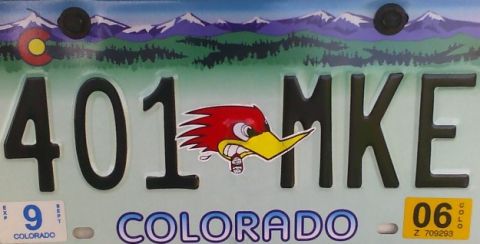 1996 Ford Probe - Colorado license plate shows "401 MKE" with a cartoon roadrunner graphic and mountain scenery.
