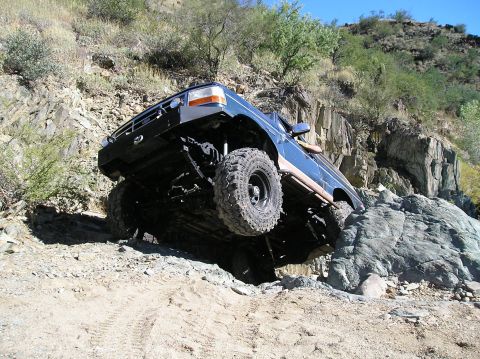 1993 Ford Bronco - This SUV is shown attempting a difficult off-road trail, with its front wheels high off the ground.