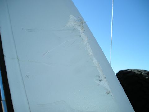 1993 Ford Bronco - Scratches and marks are visible on the exterior panel of a vehicle under-construction vehicle.