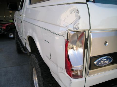 1993 Ford Bronco - This 1993 Ford Bronco shows extensive damage to its rear quarter panel and taillight assembly.