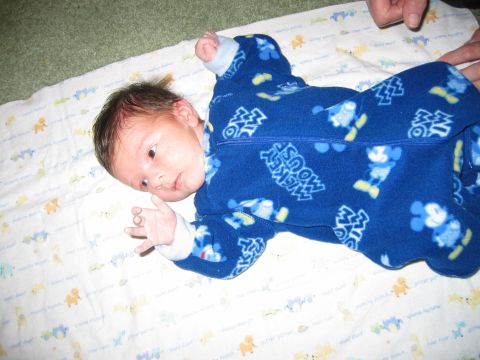 2002 Ford Taurus - A baby lies on a blanket with a Mickey Mouse pattern.