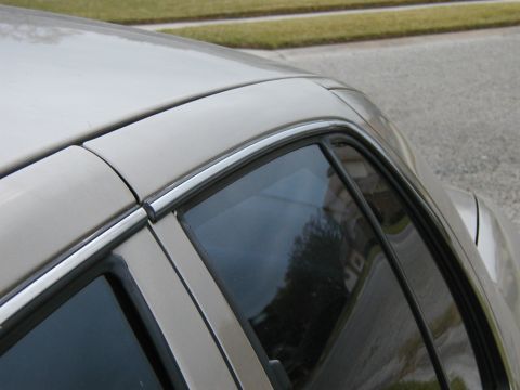 1999 Ford Crown Victoria - Close-up of the roof and window trim on a 1999 Ford Crown Victoria.