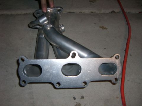 1996 Ford Probe - A custom exhaust manifold is shown, likely for an automotive application.