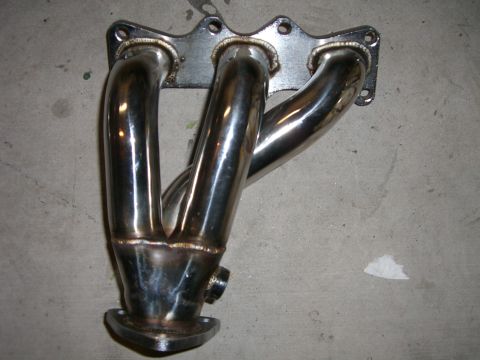 1996 Ford Probe - Aftermarket exhaust manifold, likely for a performance application.