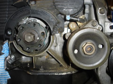 1993 Mazda MX-3 - Close-up view of engine timing belt components, including pulleys and a tensioner.