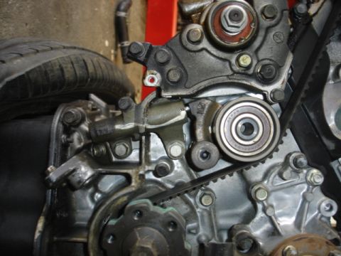 1993 Mazda MX-3 - Engine components including a timing belt and pulleys are shown in this close-up view.