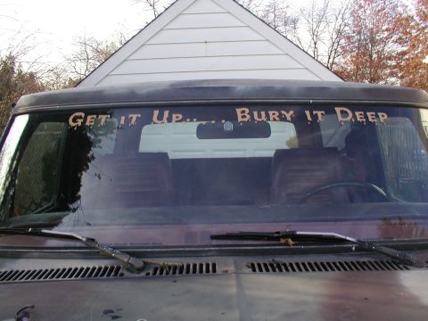 1979 Ford Bronco - The windshield of a vehicle features a custom decal with the phrase 'GET IT UP.. BURY IT DEEP'.