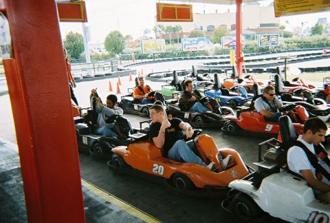 1991 Ford Probe - Go-karts are lined up at a track, with drivers seated and ready to race.