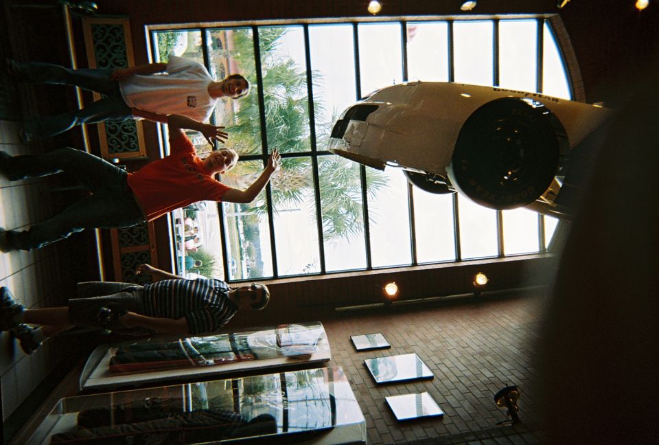 White car suspended from ceiling, viewed from below