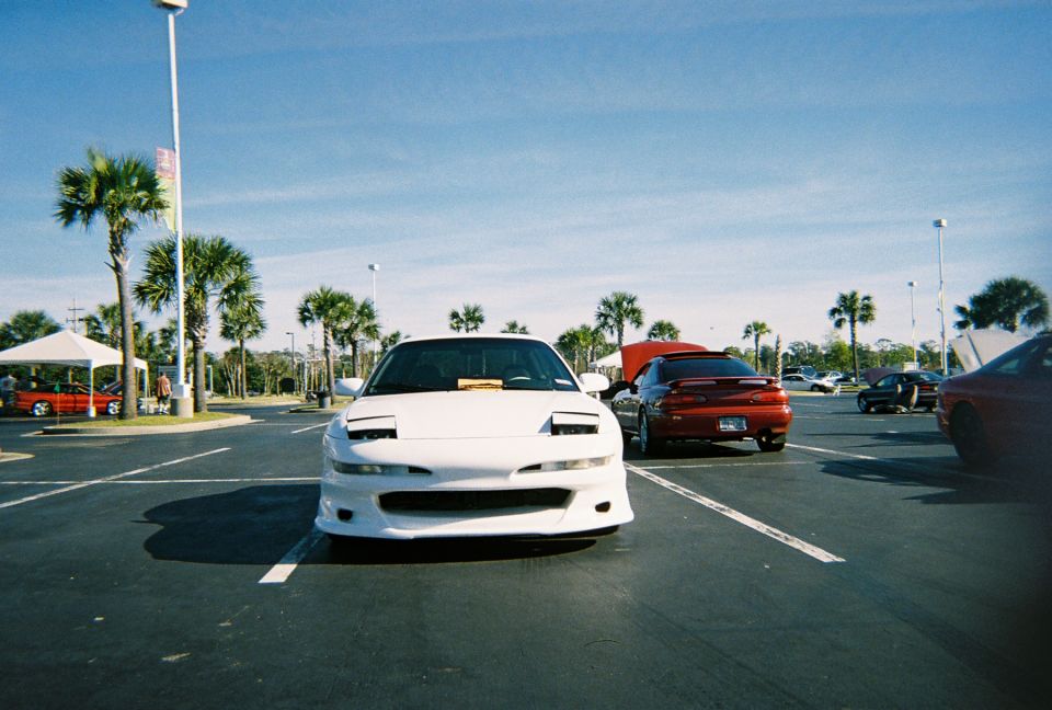 1991 Ford Probe parked in a lot, front view, pop-up headlights down
