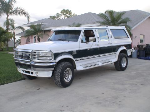 1993 Ford C-350 (Centurion Conversions) - This extended SUV features a two-tone paint scheme and chrome accents.