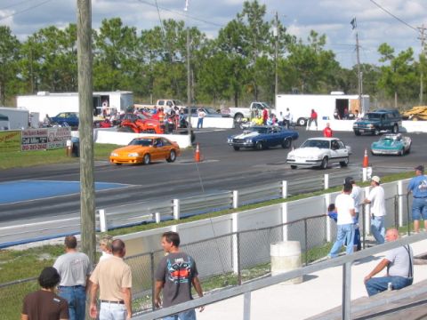1997 Ford Crown Victoria - Cars line up at the drag strip for a race.