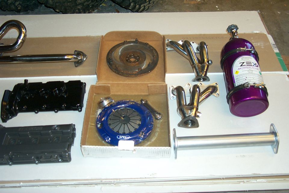 Purple nitrous oxide bottle and engine parts including headers and clutch
