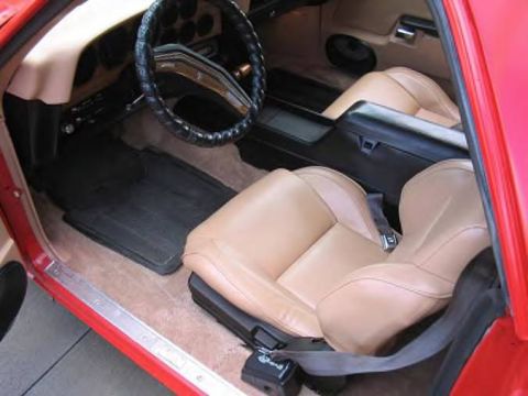 1972 Ford Ranchero - Interior view of a 1972 Ford Ranchero with tan seats and a black steering wheel.