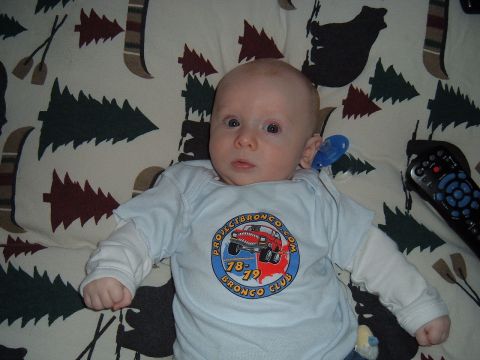 1979 Ford Bronco - A baby wears a t-shirt with a graphic referencing a Ford Bronco and the years 1978-1979.