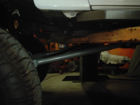 1978 Ford Bronco - Undercarriage view of a 1978 Ford Bronco, highlighting suspension components and a tire.