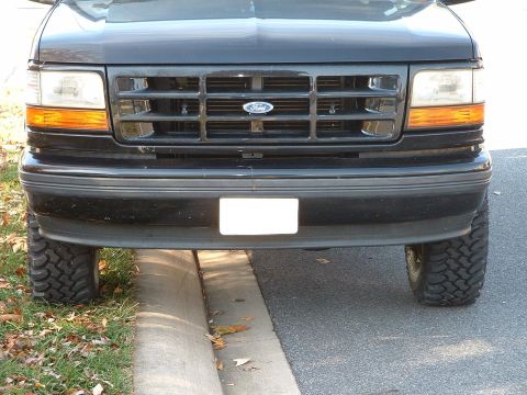 1994 Ford Bronco - The grille and headlight design are consistent with a 1994 Ford Bronco.