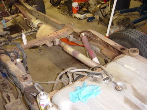 1991 Ford Bronco - These two in front of the gas tank (by the #4 crossmember) are another matter, though. Look at the hole on the left, just by the can of liq…
