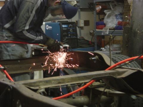 1991 Ford Bronco - Cutting out some wafer-thin "dead" metal that will trap moisture and cause more rust later.