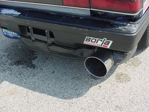 1996 Ford Probe - Car's rear bumper shows a Borla Exhaust sticker and a prominent exhaust pipe.