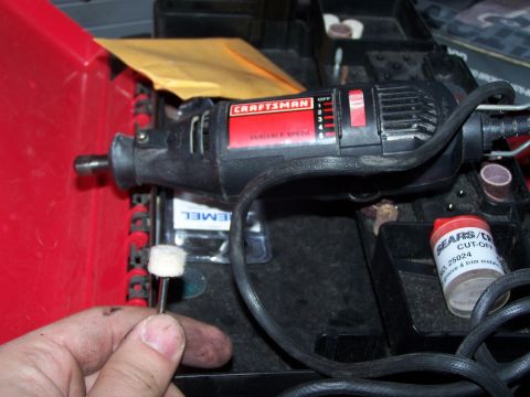 1986 Ford Bronco - A Craftsman rotary tool is shown with a polishing accessory and a container of Sears cut-off wheels, likely for automotive detailing or rep…