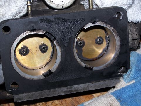 1986 Ford Bronco - Throttle body showing two butterfly valves, likely needing cleaning or replacement.