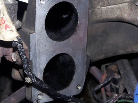 1986 Ford Bronco - This is a close-up view of an engine's intake manifold, showing two intake ports and associated wiring.