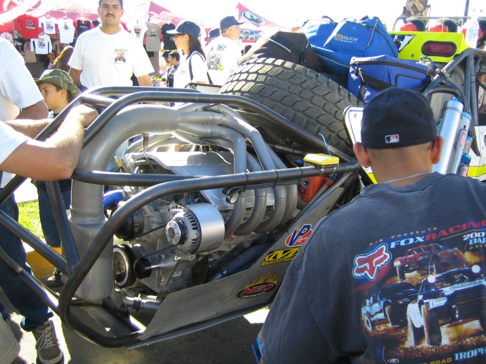 Rear engine bay of an off-road race buggy with spare tire mounted above