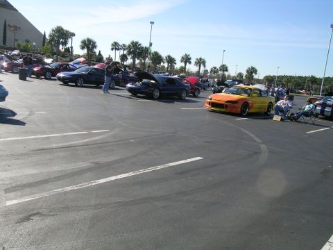 1993 Ford Probe - A 1993 Ford Probe with a custom body kit is parked at an outdoor car show.
