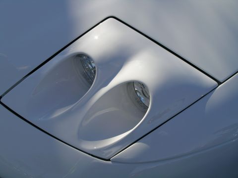 1993 Ford Probe - Close-up of the driver's side headlight on a 1993 Ford Probe.