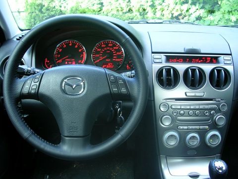2004 Mazda 6 - Interior view of a 2004 Mazda 6, the dashboard, steering wheel, and center console.