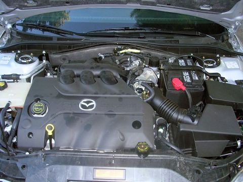 2004 Mazda 6 - The engine bay of a 2004 Mazda 6 is visible, the V6 engine and associated components.