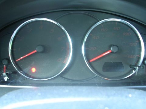 2004 Mazda 6 - The dashboard shows the speedometer and tachometer gauges, with the speedometer indicating a low speed.