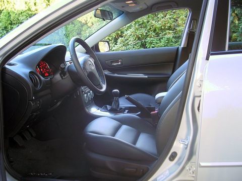 2004 Mazda 6 - Interior view of a 2004 Mazda 6, highlighting the dashboard and seating.