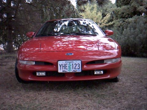 1996 Ford Probe - Front view of a red car parked outdoors with an Oregon license plate.