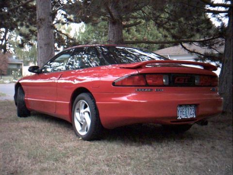 1996 Ford Probe - Red 1996 Ford Probe GT with a rear spoiler and aftermarket wheels.