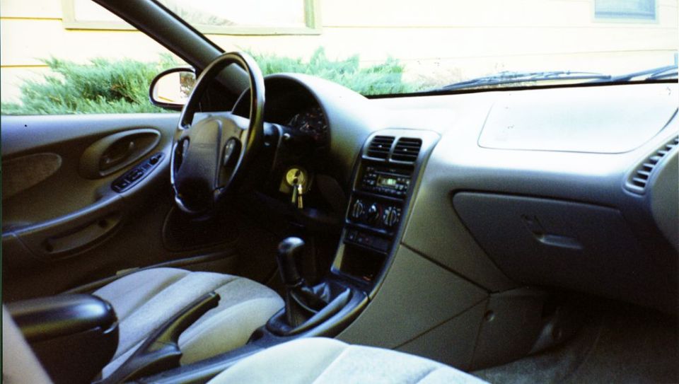 1996 Ford Probe interior showing dashboard, steering wheel, center console, and seats