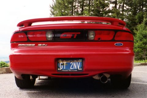 1996 Ford Probe - Rear view of a red 1996 Ford Probe GT 24V, its distinctive spoiler and GT badging.