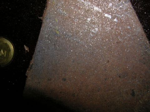 1996 Ford Probe - A close-up view of a corroded metal surface, possibly from a vehicle part, with visible rust and debris.