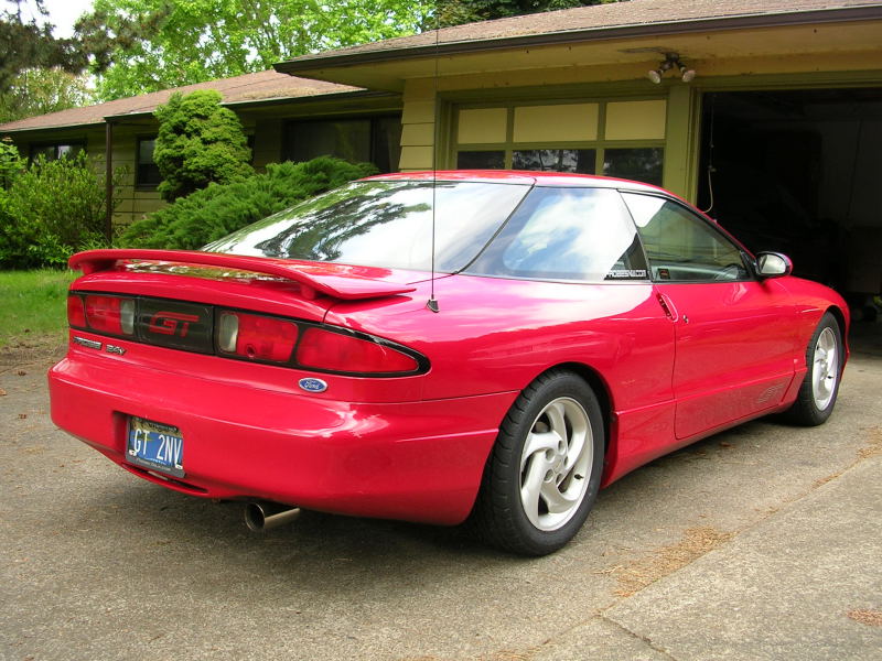 Red 1996 Ford Probe GT rear 3/4 view