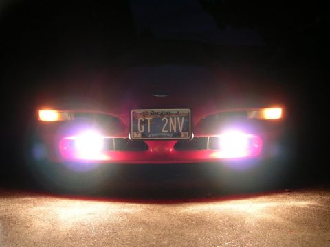 1996 Ford Probe - The car's front end is illuminated by its bright headlights and fog lights, with an Oregon license plate visible.