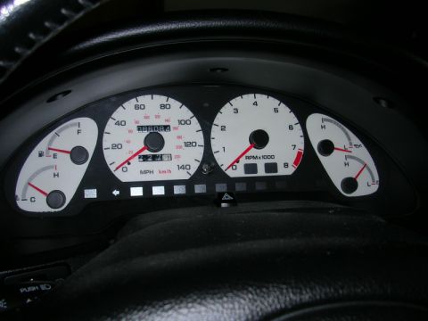 1996 Ford Probe - Close-up of a car's instrument cluster showing speed, RPM, fuel, and temperature readings.